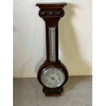 A carved oak Banjo Barometer