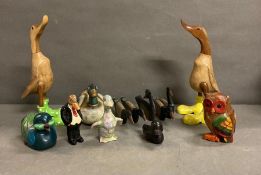 A large selection of decorative ducks in various styles and one owl.