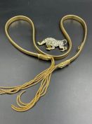 Costume jewellery, a panther brooch and a snake strap.