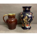 Two ceramic items. A Denby stoneware jug in green and brown and and an etched cobalt blue vase