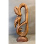 A wooden modern abstract sculpture of two people kissing (H59cm)