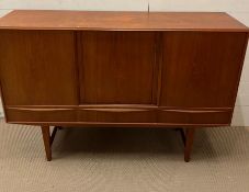 A Mid Century sideboard, three doors opening to shelves and drawers and three drawers to base on