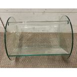 A glass magazine rack (H28cm W37cm D30cm)