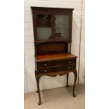 A mahogany side cabinet with glazed book case