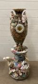 An abstract ceramic sculpture with ornamental barometer face to face from the set of Great