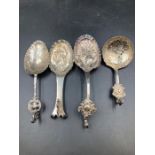 A selection of four antique silver Dutch caddy spoons