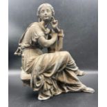 A cast metal classical figure of a lady playing a lyre. (Approximate 26cm H)