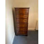 A chest of drawers in the style of a chest on chest (H132cm W55cm D41cm)