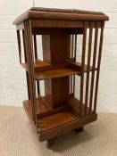 A mahogany revolving bookcase with inlaid top (H94cm Dia48cm) AF
