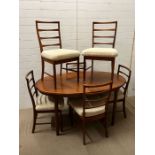 A McIntosh teak dining room table and six chairs (H77cm W150cm D95cm)