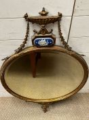 A wall hanging round decorative mirror