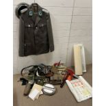 A selection of military uniform items, books and posters