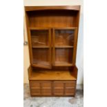 A side cabinet with glazed doors and panelled cupboard under by Nathan (H184cm W102cm D45cm)