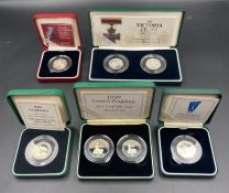 Royal Mint a selection of seven boxed with papers silver proof 50 pence coins celebrating various
