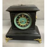 A slate clock on gilt feet by Connell of London
