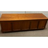 A Mid Century hinged chested panelled to front