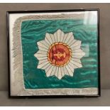 A framed reproduction East German flag