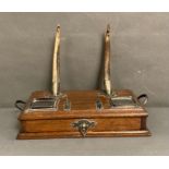 An oak single drawer desk tidy with white metal mounted antlers