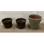 Three glazed terracotta garden plant pots