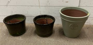 Three glazed terracotta garden plant pots