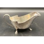 A silver sauce boat on three hoof feet, hallmarked for Edinburgh 1937 by Brook & Son (Approximate