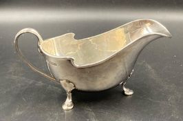 A silver sauce boat on three hoof feet, hallmarked for Edinburgh 1937 by Brook & Son (Approximate