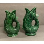 Two Dartmouth pottery green fish jugs