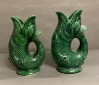 Two Dartmouth pottery green fish jugs