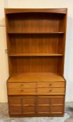 A side cabinet or dresser with four drawers and panelled cupboard by Nathan (H194cm W102cm D45cm)