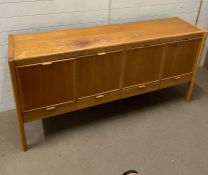 A Mid Century sideboard with four doors to front and drawers under (H86cm W175cm D45cm)