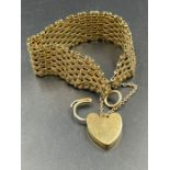 A 9ct gold gate bracelet with heart shaped fastener (Approximate Total Weight 28g)