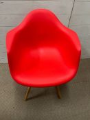 A contemporary chair in the style of Herman Miller Eames