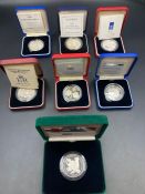 Royal Mint a selection of seven boxed with papers silver proof £5 coins celebrating various world