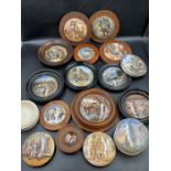 An assortment of framed and unframed Staffordshire pot lids