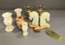 A selection of onyx, vase, door stop, etc