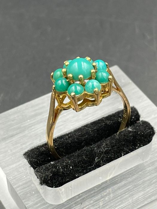 A 9ct gold ring with turquoise stones (Approximate Total Weight 3.2g) Size S
