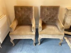 A pair of button back arm chairs on cabriole legs
