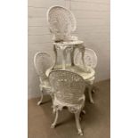 A white painted metal garden table and four chairs