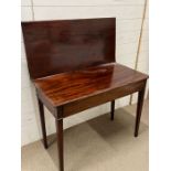 A mahogany tea table with hinged fold out extension (H74cm W92cm D45cm)