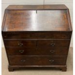 A Queen Anne bureau, the fall front enclosing fitted interior of pigeon holes, drawers and a sliding