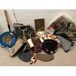 A selection of reproduction military items including caps, gas mask etc