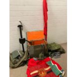 A large selection of reproduction military equipment to include flags, a shovel and a chest