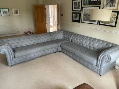 A contemporary button back grey corner sofa (290cm X 290cm SH46cm)