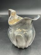 A silver milk jug hallmarked for London 1805 by Samuel & Edward Davenport