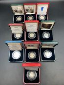 Royal Mint a selection of ten boxed with papers silver proof 50 pence coins celebrating various