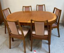 A Mid Century Nathan dining table with six chairs and centre leaf (H76cm W152cm D98cm)