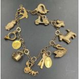 A 9ct gold charm bracelet with assorted charms (Approximate Total Weight 12.7g)