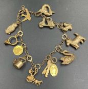 A 9ct gold charm bracelet with assorted charms (Approximate Total Weight 12.7g)