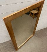 A contemporary pine style mirror (80cm x 114cm)