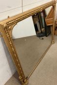 A mahogany gold painted over mantel mirror (121cm x 147cm)